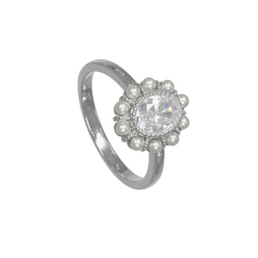 A silver ring featuring a central round clear gemstone surrounded by a halo of small silver pearls