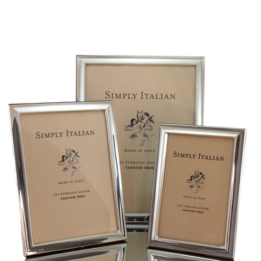 Three silver beaded picture frames with a polished wood back and tarnish-free finish.