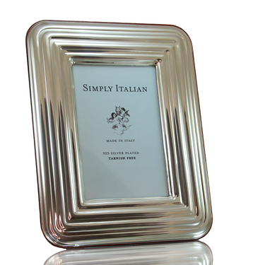 A light silver, wood veneer back, ridged frame. Made in Italy, with a tarnish-free finish.