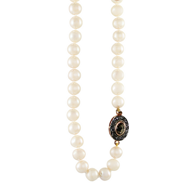 A white pearl choker necklace with a black and crystal oval Italian clasp.