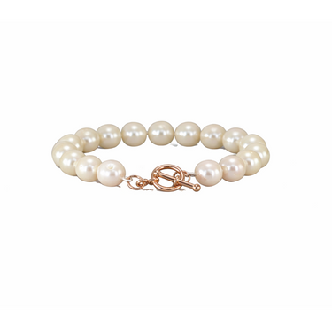 Pearl bracelet with a rose gold clasp on a white background