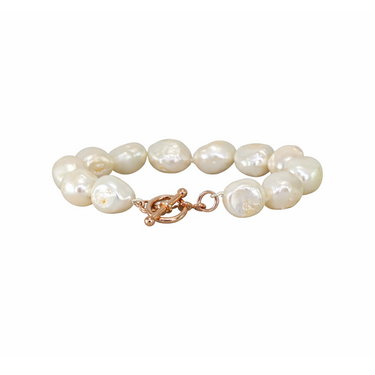Baroque pearl bracelet with a gold clasp on a white background
