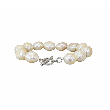 Baroque pearl bracelet with a silver clasp on a white background