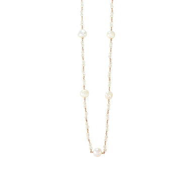 A necklace with white pearls and crystal embellishments, with a rose gold finish on a silver chain.
