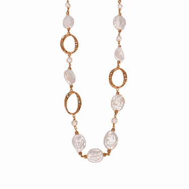 Baroque freshwater pearl necklace pairs lustrous white pearls interspersed with rose gold hoops.