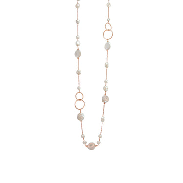 A pearl, coin pearl, and rose gold circle link necklace on a rose gold chain