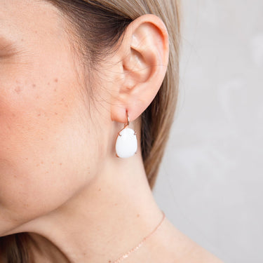 White oval crystal earrings 18ct rose gold and sterling silver.
